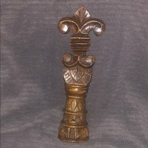 Wooden fleur de lis statue